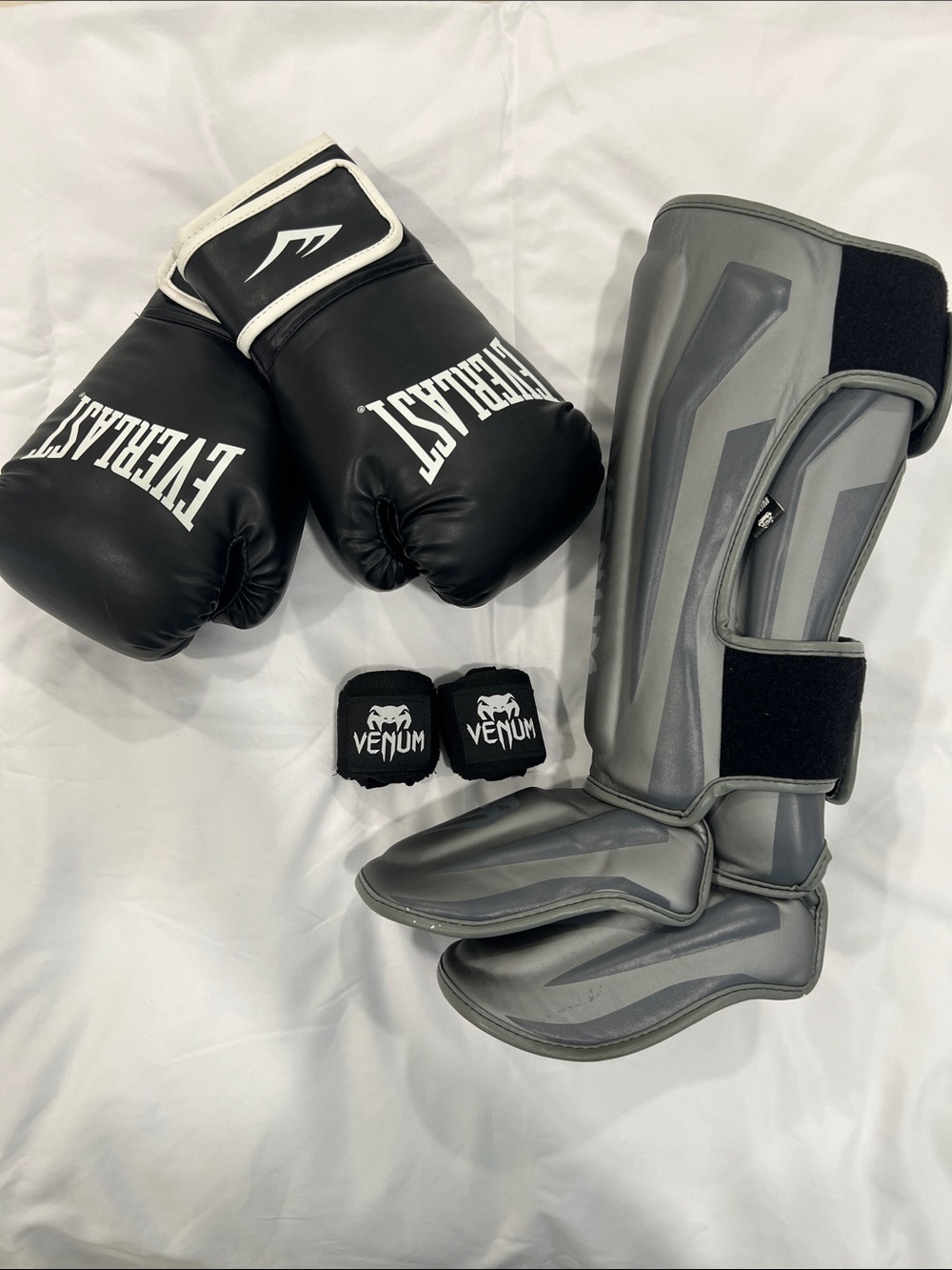 Everlast Black Boxing Gloves with Venum Black Wrist Wraps and Venum Shin Guards